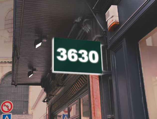 Digital display showing the number '3630' on a building exterior.