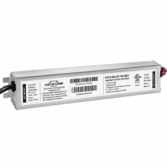 Keystone Technologies KTLD-60-UV-12V-MC1 constant voltage LED driver power supply, featuring a silver metal housing with black and red wires, shown on a white background.