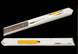 Two white sheet cutters with yellow accents on a black background