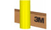 Yellow roll of 3M vinyl wrap against a cardboard box background