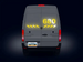 Back view of a van with digital display and license plate on a dark background