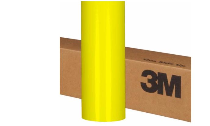 Yellow roll of 3M vinyl on a cardboard box with 'This Side Up' text.