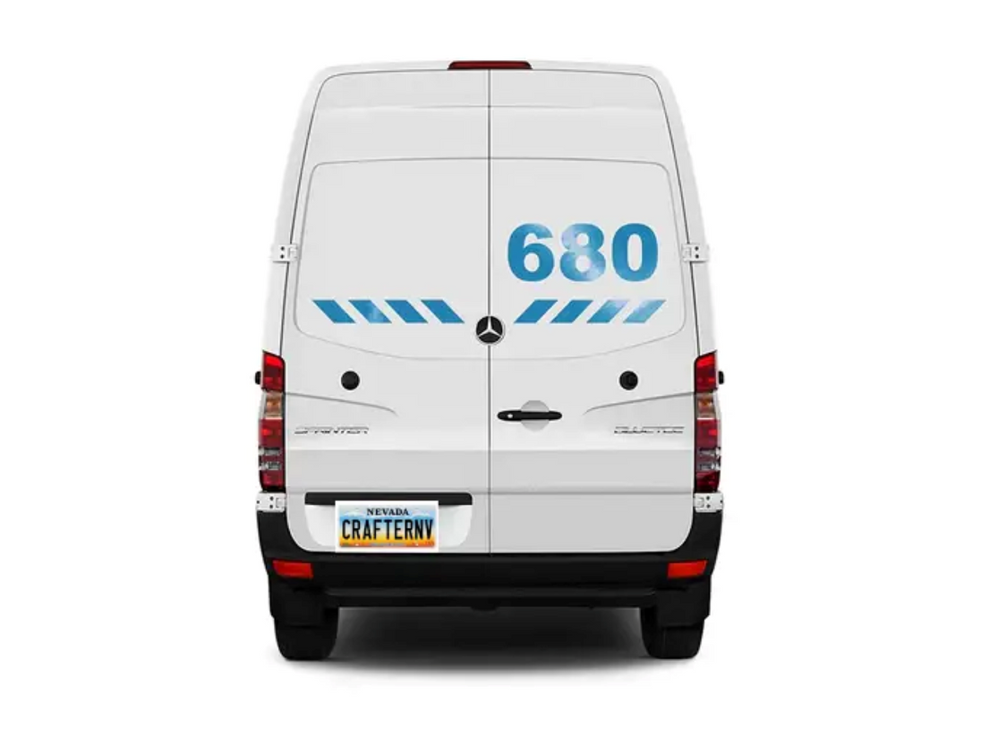 Back view of a white van with blue numbering on a white background
