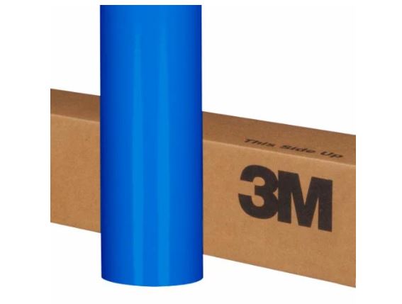 Roll of blue 3M vinyl wrap on a cardboard box