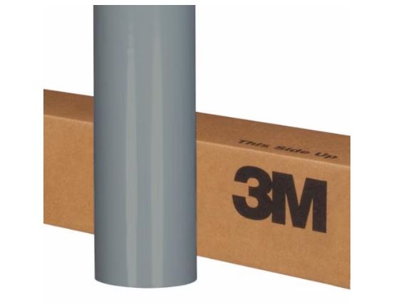 Roll of gray vinyl wrap on a cardboard box with 3M branding.