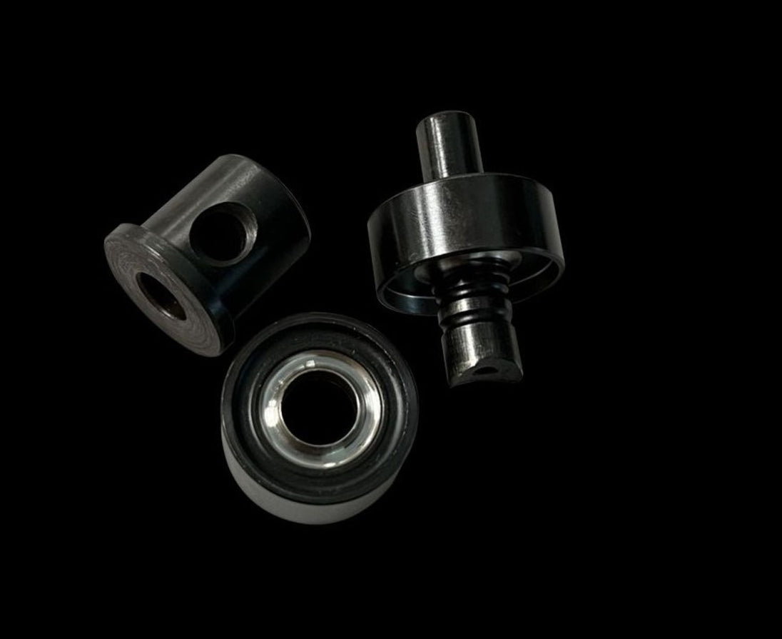Three metal bearings on a black background