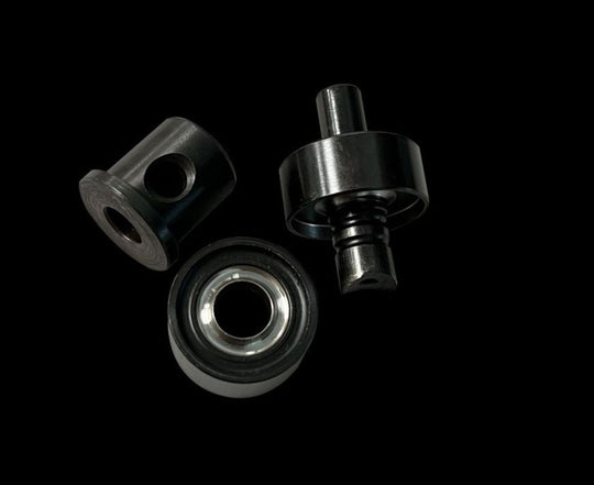 Three metal bearings on a black background