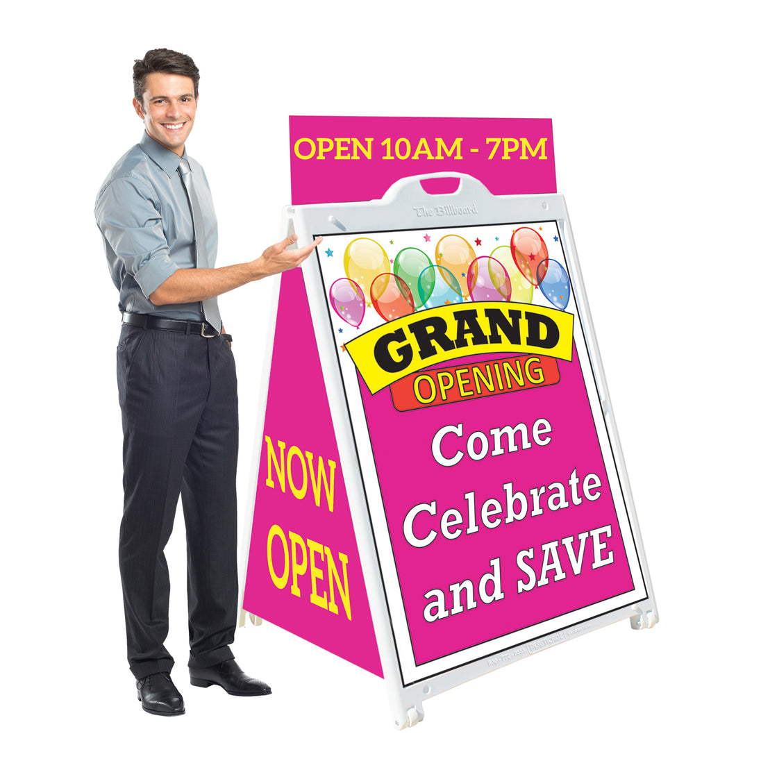 Man holding a pink grand opening sign with colorful balloons and text.