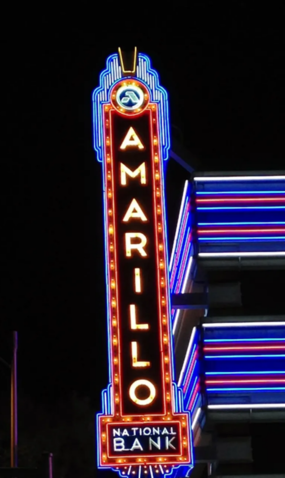 Neon sign for Amarillo National Bank against a dark background