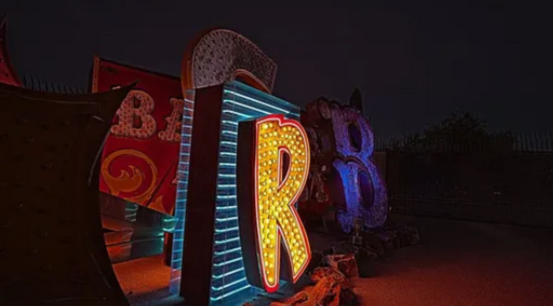 Colorful neon signs on a dark background