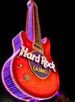 Red electric guitar-shaped neon sign with 'Hard Rock Casino' branding on a dark background