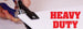 Hand using a heavy-duty paper cutter with 'HEAVY DUTY' text displayed.