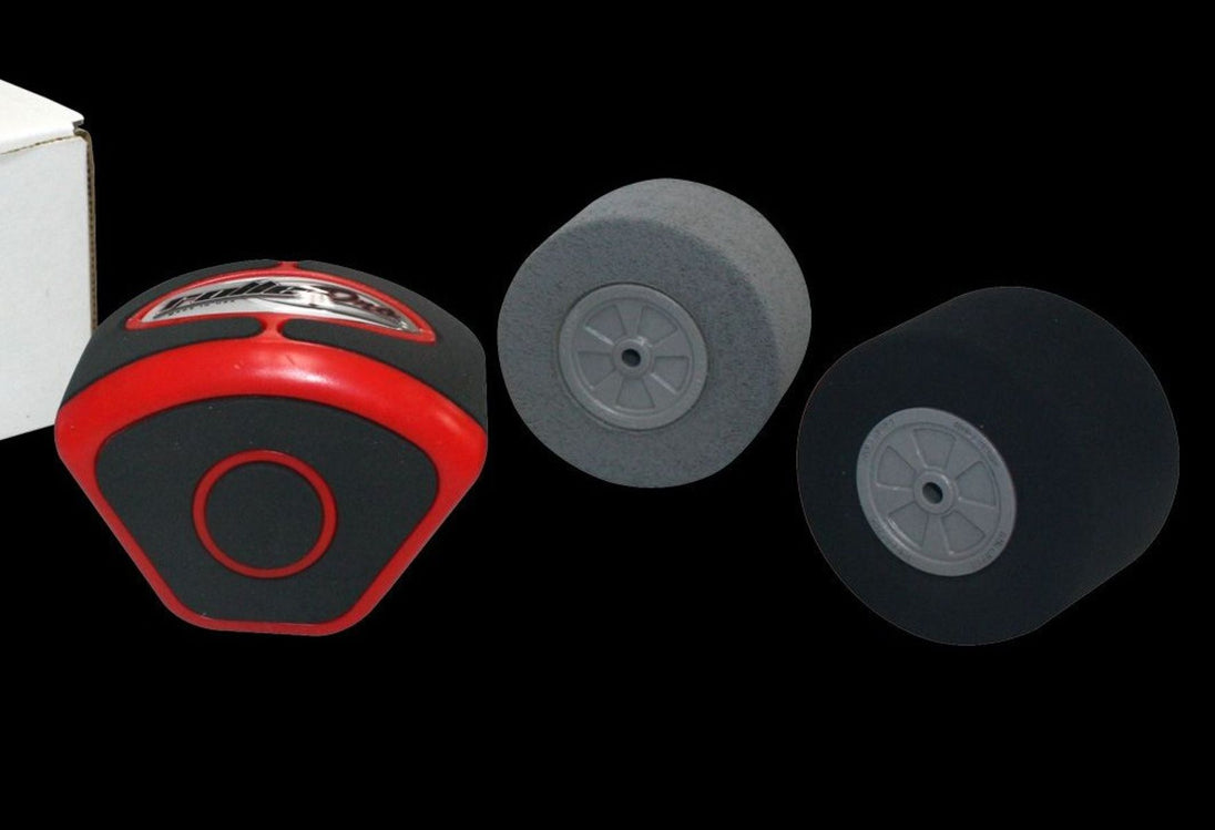 Red and black tool with two gray wheels on a black background