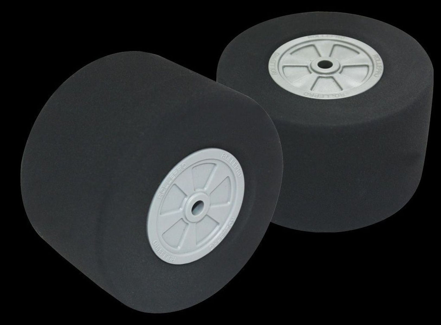 Two black wheels with white centers on a transparent background