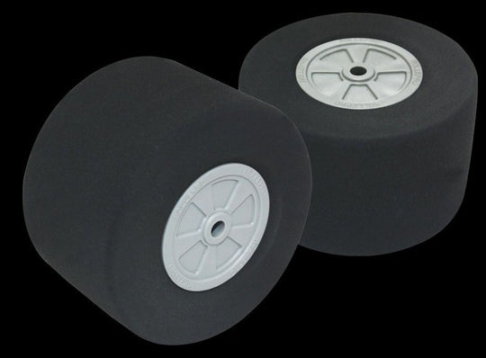 Two black wheels with white centers on a transparent background