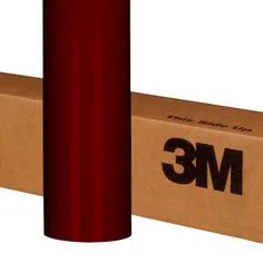 Red roll of 3M tape with a cardboard box in the background