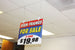 Promotional sign for sign frames on sale in a store setting