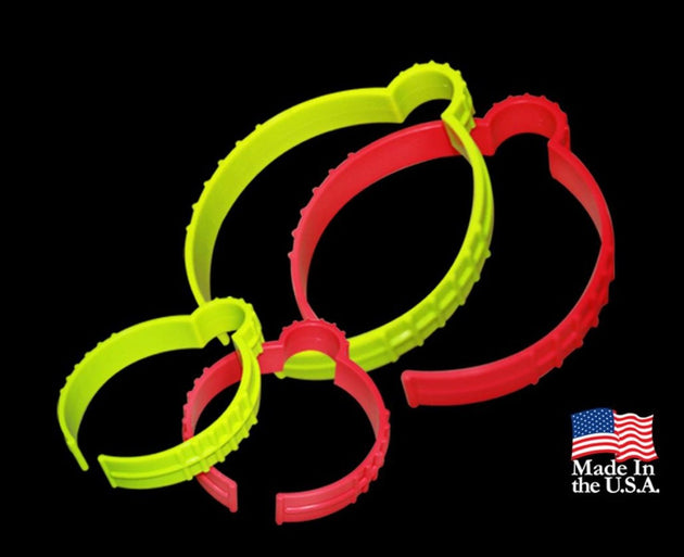 Two green and red plastic rings on a black background with 'Made in the USA' label.