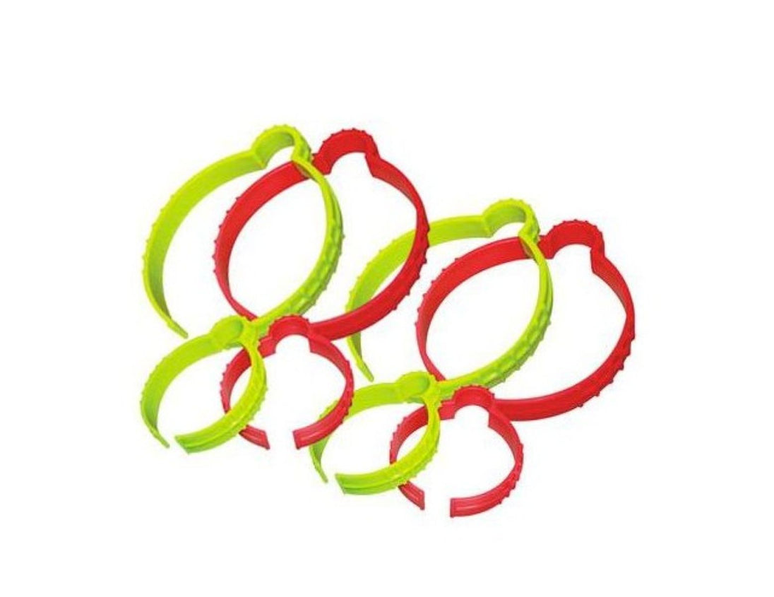 Set of red and green plastic rings on a white background