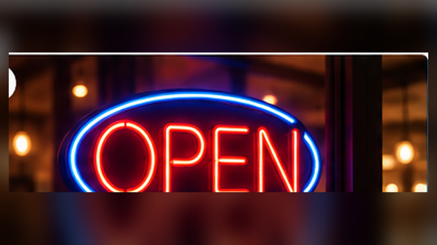 Illustrative red and blue illuminated OPEN neon storefront window sign; application illustration for Allanson SS1235ICH indoor neon power supply
