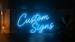 Illustrative blue Custom Signs neon wall display in an indoor room; application illustration for Allanson SS635ICH indoor neon power supply