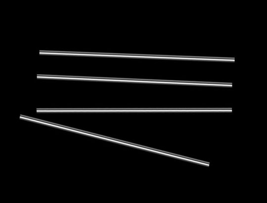 Set of five metallic rods on a black background