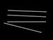Set of five metallic rods on a black background