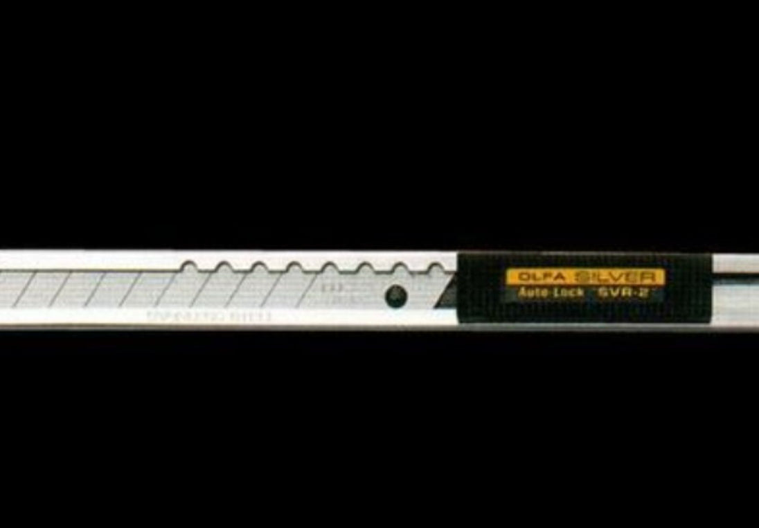 Olfa knife with a black background