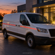 Illustrative application concept for reflective vinyl striping: service van accent striping at dusk. Scene colors are examples, not an exact Orange shade reference.