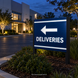 Illustrative application concept for reflective vinyl striping: private-property wayfinding sign. Scene colors are examples, not an exact Sapphire Blue shade reference.