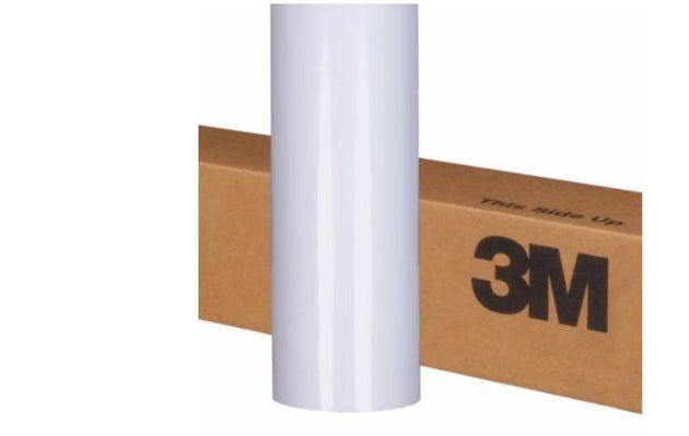 Roll of 3M paper on a cardboard box with 'this side up' label.