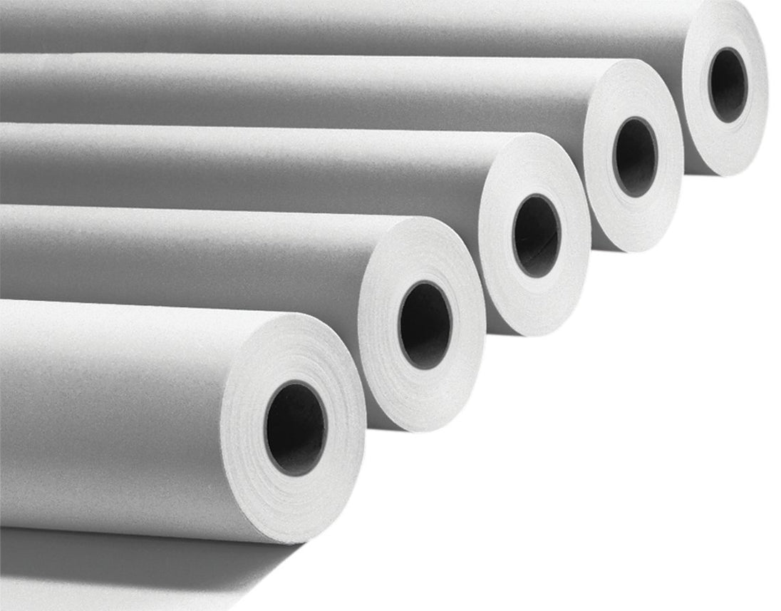 Rolls of paper stacked on a white background