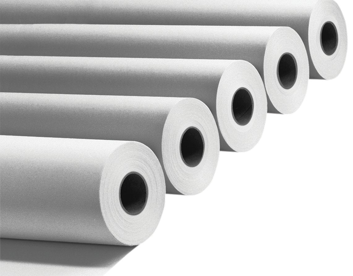 Rolls of paper stacked on a white background