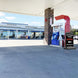 Gas station with a fuel pump and car wash sign on a clear day.