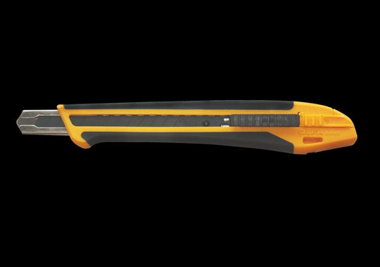 Yellow and black utility knife on a white background