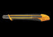 Yellow and black utility knife on a white background