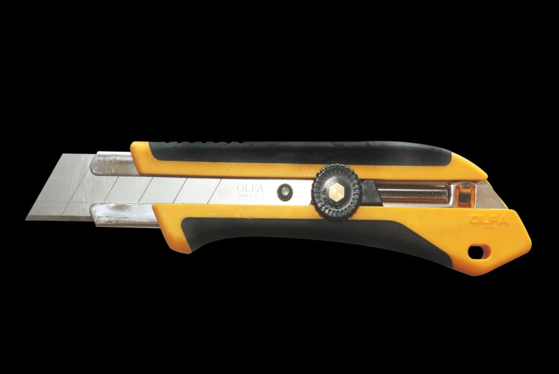 Yellow and black utility knife on a white background