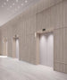 Modern elevator lobby with wooden panel walls and ceiling lights.