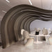Modern office space with wavy wooden wall and minimalist furniture