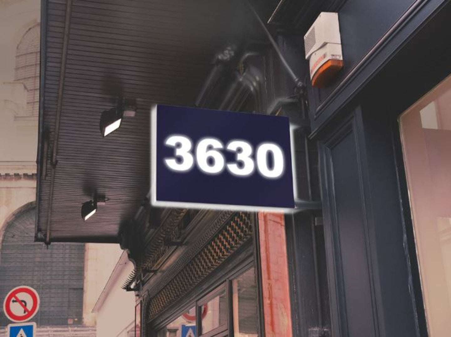 Digital display with the number '3630' on a building exterior.