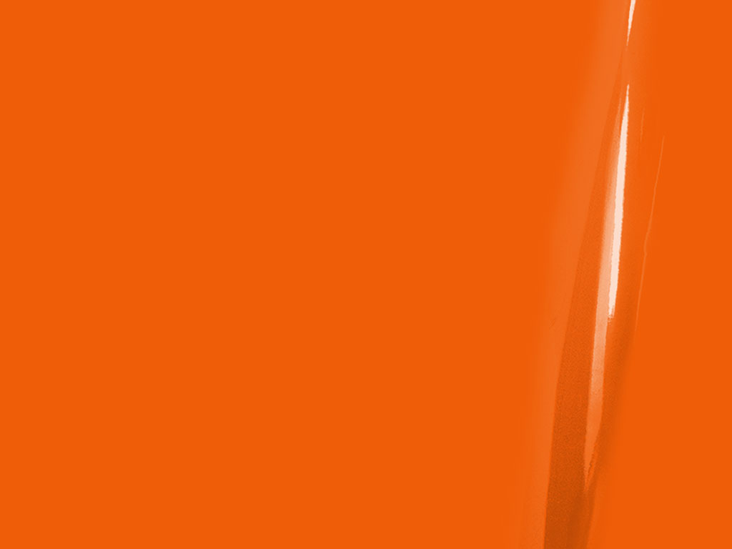 Close-up of a bright orange surface with a slight reflection