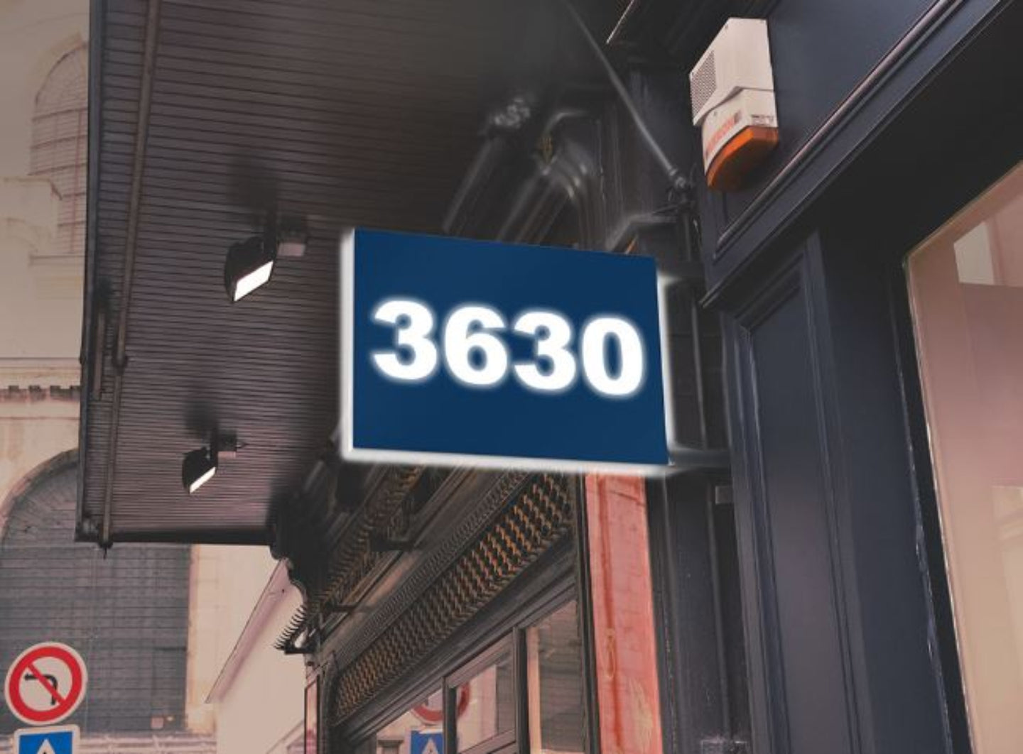 Building facade with a Bristol Blue sign displaying the number '3630'.