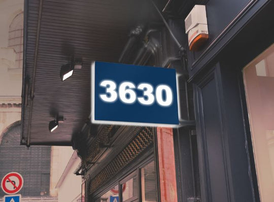 Building facade with a Bristol Blue sign displaying the number '3630'.