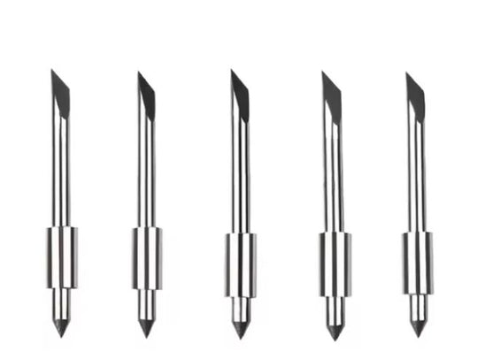 Set of five metallic pen tips on a white background