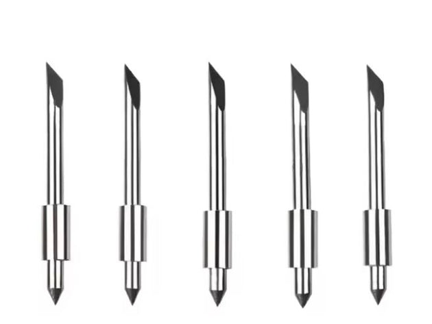 Set of five metallic pen tips on a white background