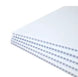 Stack of white honeycomb panels on a white background