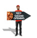 Person holding a 'Rustic Family Grand Opening' sign with pizza graphics.