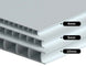 Stack of polycarbonate sheets with thickness labels on a gray background