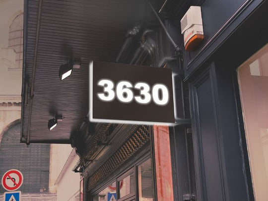 Digital display showing the number '3630' on a building exterior.