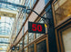 Sign with the number 50 hanging from a building in an urban setting